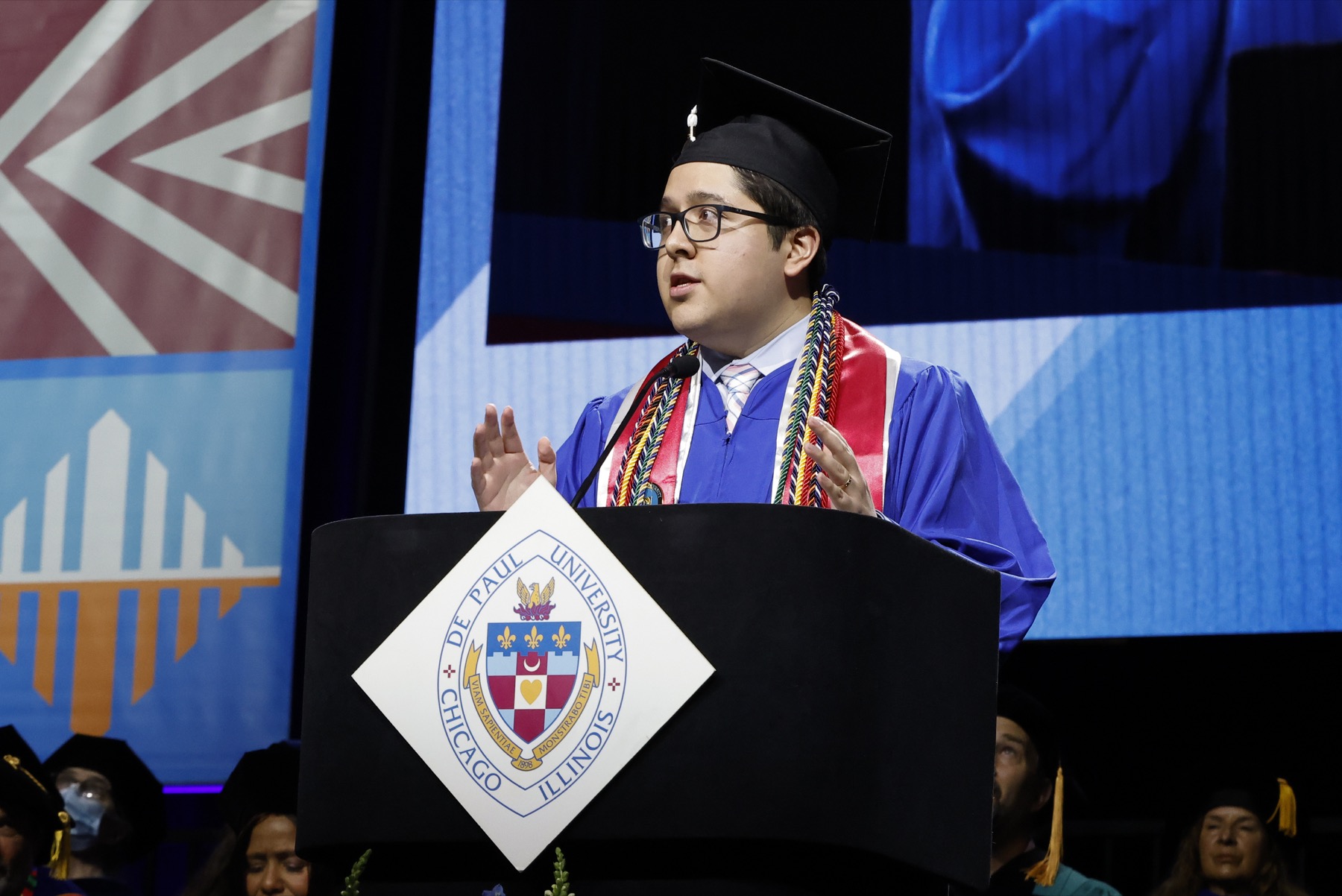 Lenin Plazas, student speaker, shared his story as the child of immigrant parents, a DACA-dreamer and now a first-generation DePaul graduate.